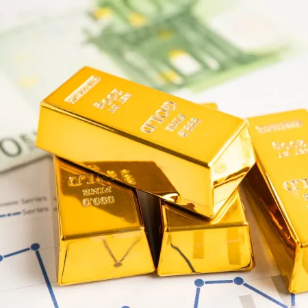 gold-bar-on-graph-with-eu-banknote-economy-finance-exchange-trade-investment-concept