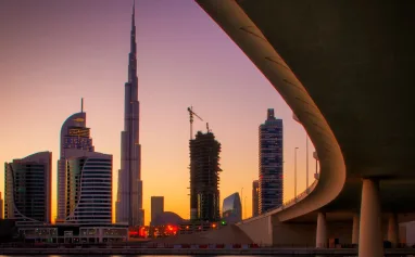 reflection-of-tallest-skyscrapers-in-business-bay-downtown-summer-day-dubai-united-arab-emirates