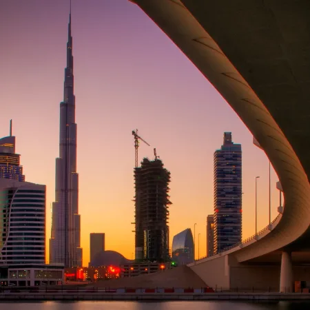 reflection-of-tallest-skyscrapers-in-business-bay-downtown-summer-day-dubai-united-arab-emirates